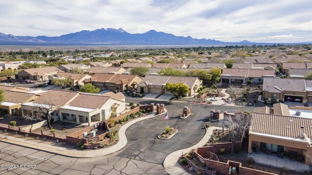 drone / aerial view featuring a residential view and a mountain view
