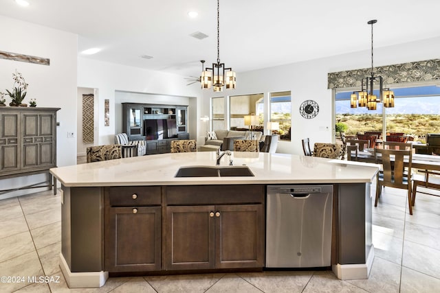 kitchen featuring a sink, hanging light fixtures, dishwasher, and a chandelier