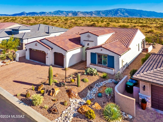 birds eye view of property featuring a mountain view