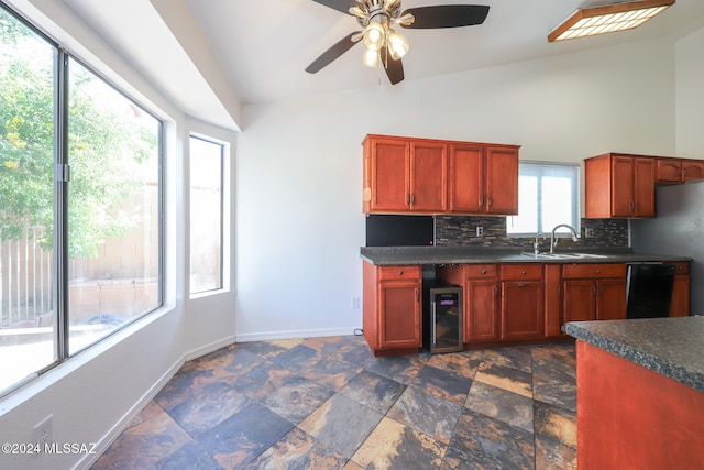 kitchen with lofted ceiling, backsplash, beverage cooler, sink, and dishwasher