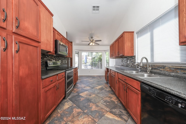 kitchen with ceiling fan, sink, lofted ceiling, backsplash, and appliances with stainless steel finishes