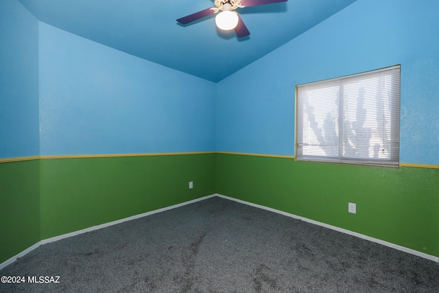 unfurnished room featuring vaulted ceiling, carpet, and ceiling fan