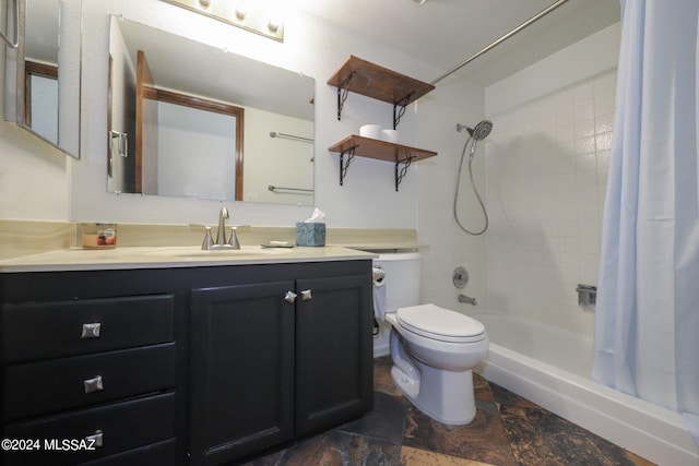 full bathroom with shower / bath combo, vanity, and toilet