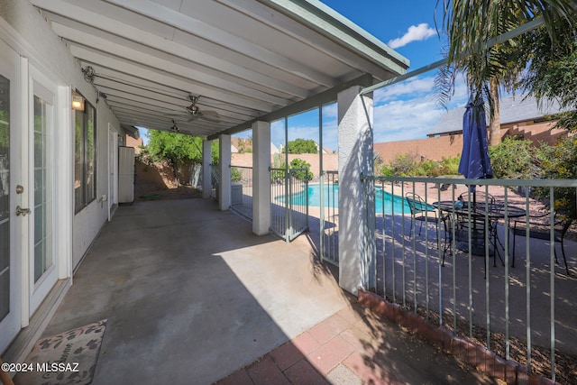 view of patio featuring a fenced in pool