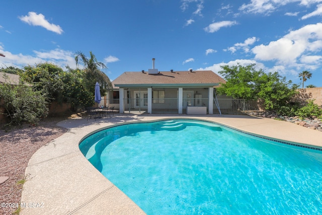 view of pool featuring a patio