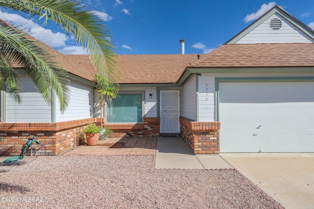 single story home featuring a garage