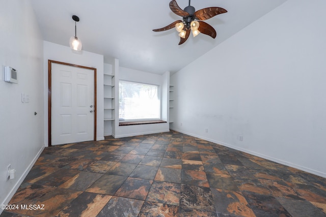 foyer with ceiling fan and vaulted ceiling