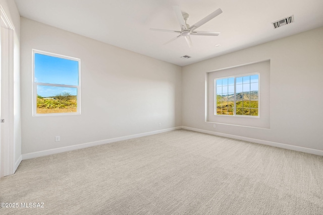 67970 E Madison Rd, Oracle, AZ 85623 - unfurnished room with light colored carpet and ceiling fan