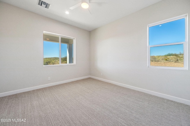 67970 E Madison Rd, Oracle, AZ 85623 - unfurnished room with ceiling fan, healthy amount of natural light, and carpet flooring