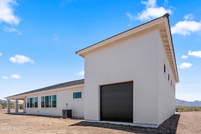 67970 E Madison Rd, Oracle, AZ 85623 - view of home's exterior featuring a garage and stucco siding