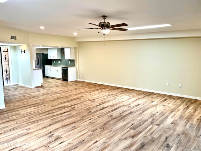 unfurnished living room featuring light hardwood / wood-style floors and ceiling fan