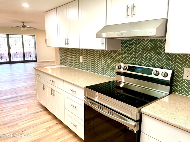 kitchen featuring electric stove, white cabinetry, ceiling fan, light hardwood / wood-style flooring, and ventilation hood