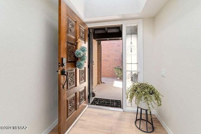 doorway to outside featuring light wood-type flooring