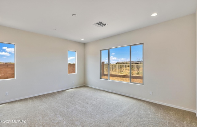 8257 S Silver Oak Dr, Tucson, AZ 85747 - spare room featuring carpet floors, baseboards, and recessed lighting