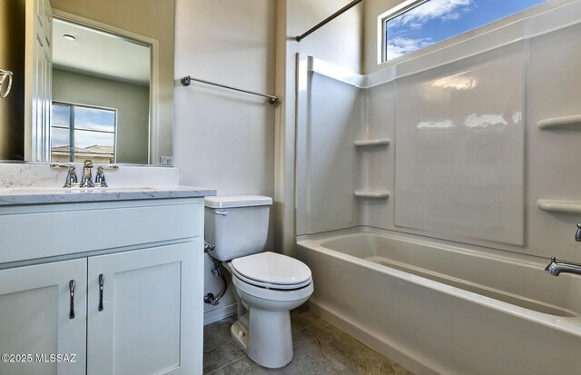 8257 S Silver Oak Dr, Tucson, AZ 85747 - full bath featuring bathtub / shower combination, toilet, vanity, tile patterned flooring, and baseboards