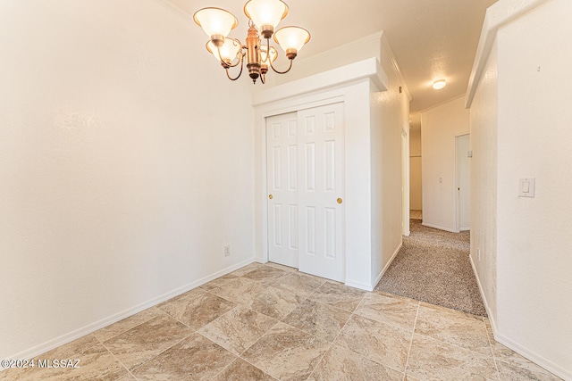 interior space featuring crown molding and a chandelier