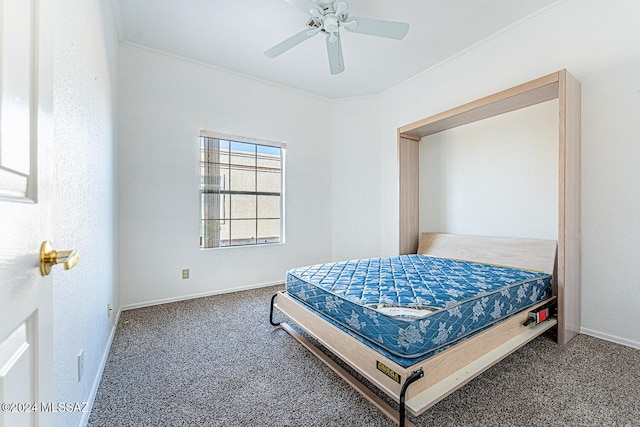 bedroom featuring ornamental molding, ceiling fan, and carpet