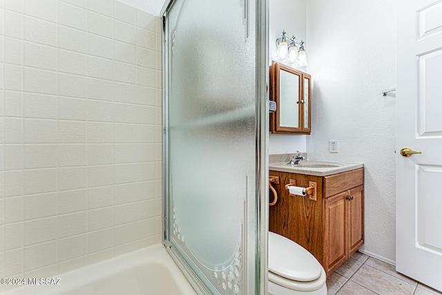 bathroom with tile patterned floors, toilet, and vanity