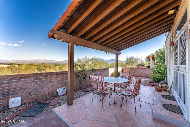 view of patio / terrace with a mountain view