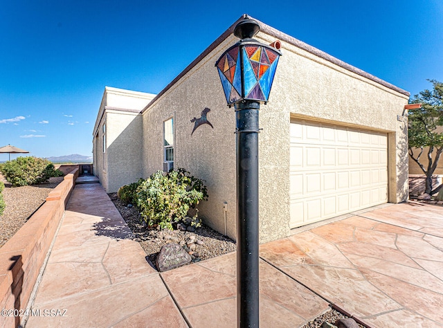 view of side of property with a garage