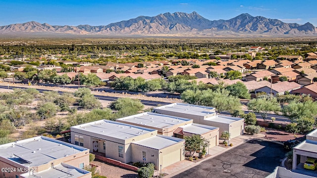 birds eye view of property featuring a mountain view