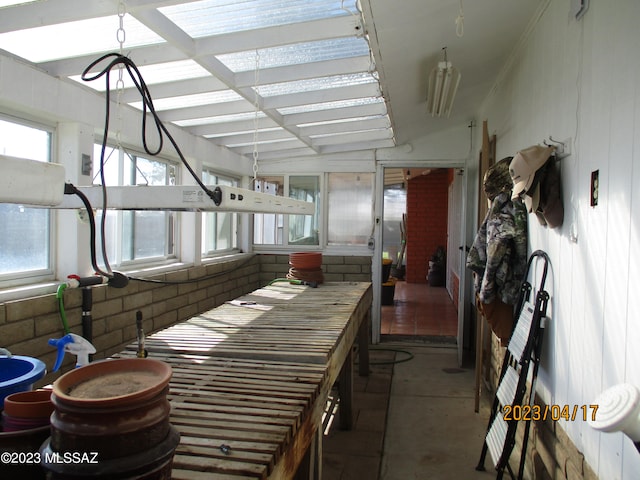 interior space with lofted ceiling and concrete floors