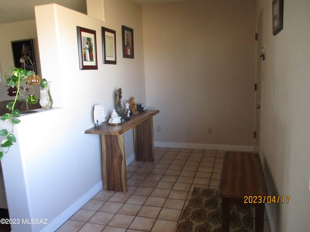 hall with light tile patterned flooring