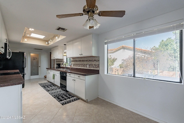 kitchen with ceiling fan, a wealth of natural light, tasteful backsplash, and white cabinetry