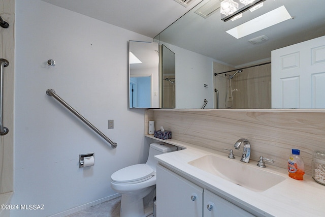 bathroom with a skylight, toilet, decorative backsplash, vanity, and a shower with curtain