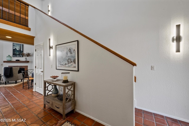 stairs featuring a high ceiling