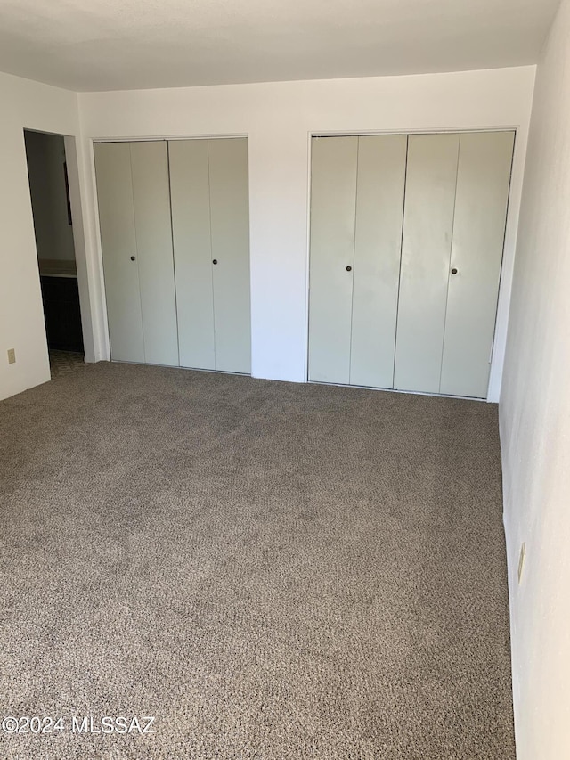 6352 N Barcelona Ln Unit 106, Tucson, AZ 85704 - unfurnished bedroom with multiple closets and carpet flooring