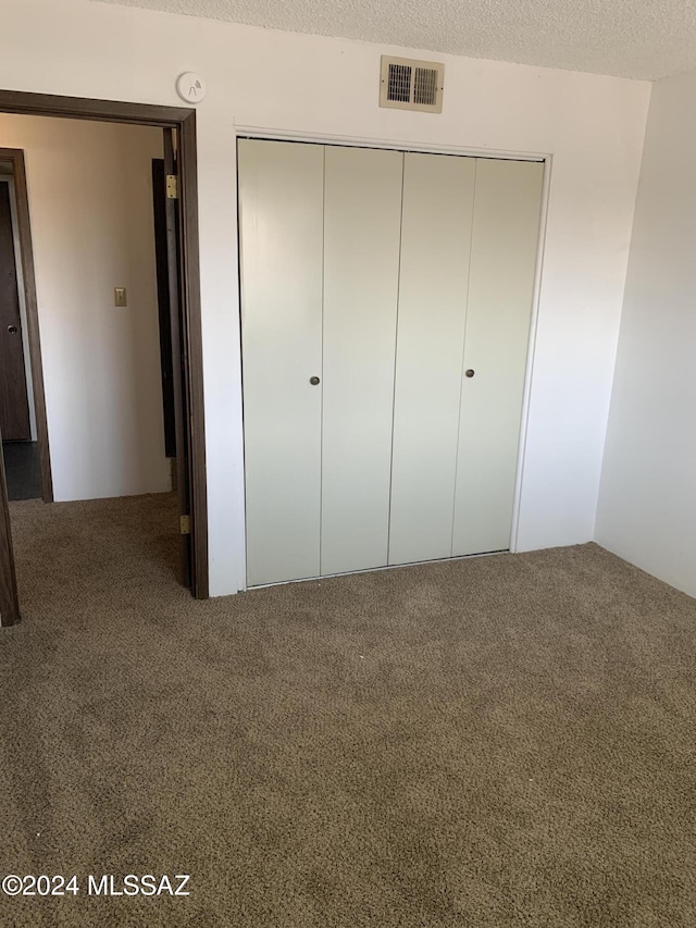 6352 N Barcelona Ln Unit 106, Tucson, AZ 85704 - unfurnished bedroom with carpet and a closet
