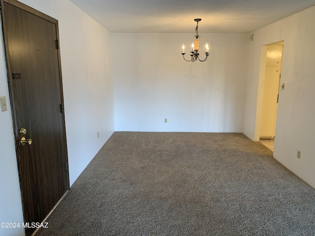 6352 N Barcelona Ln Unit 106, Tucson, AZ 85704 - spare room featuring light colored carpet and a chandelier
