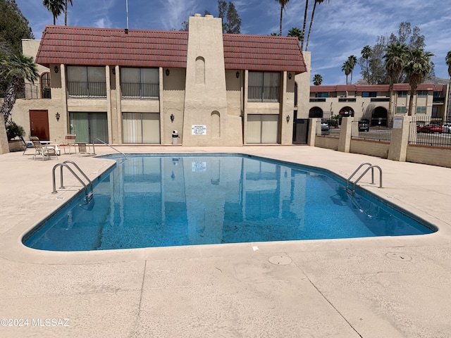 6352 N Barcelona Ln Unit 106, Tucson, AZ 85704 - community pool featuring a patio area and fence