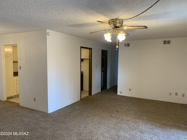 6352 N Barcelona Ln Unit 106, Tucson, AZ 85704 - unfurnished room with light carpet, a ceiling fan, and a textured ceiling