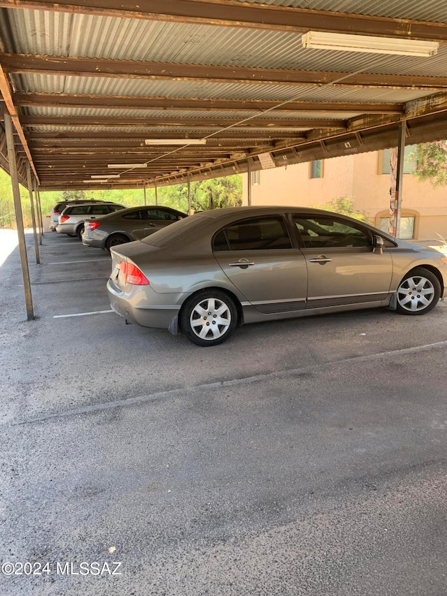 view of parking / parking lot with a carport