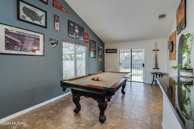 recreation room with lofted ceiling, a textured ceiling, billiards, and light tile patterned floors