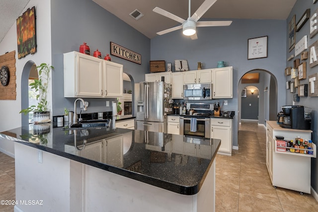 kitchen featuring sink, appliances with stainless steel finishes, and white cabinetry