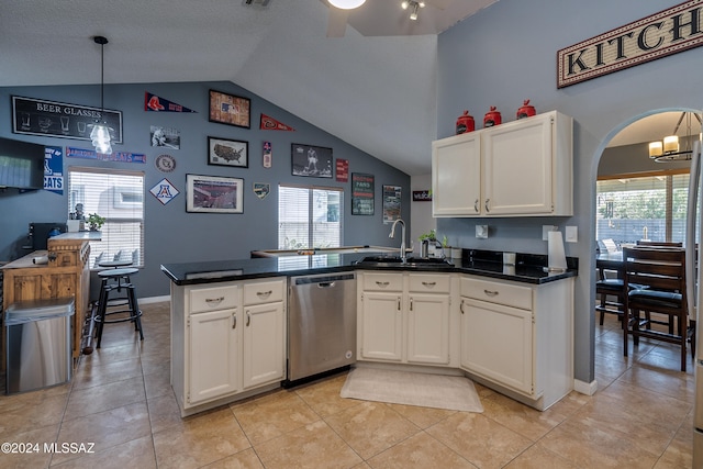 kitchen featuring dishwasher, kitchen peninsula, sink, decorative light fixtures, and white cabinets