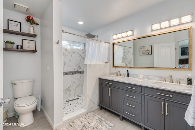 bathroom with vanity, walk in shower, toilet, and tile patterned floors