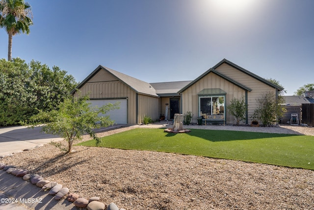 ranch-style house with a front yard and a garage