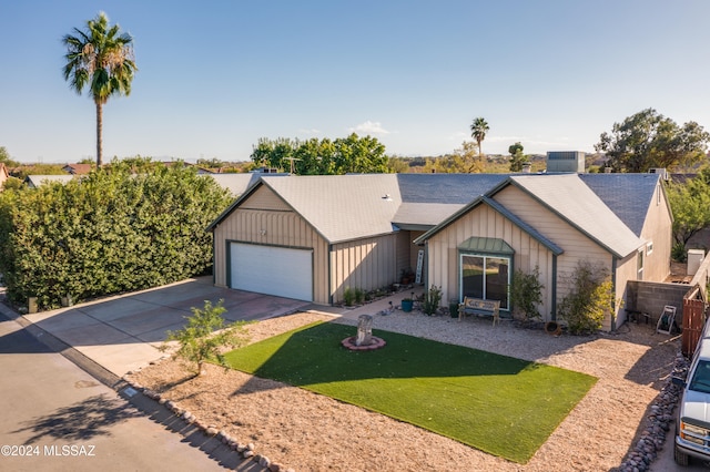 view of front of house with a front lawn and a garage