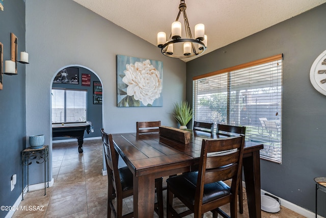 dining area featuring an inviting chandelier, vaulted ceiling, a textured ceiling, and billiards