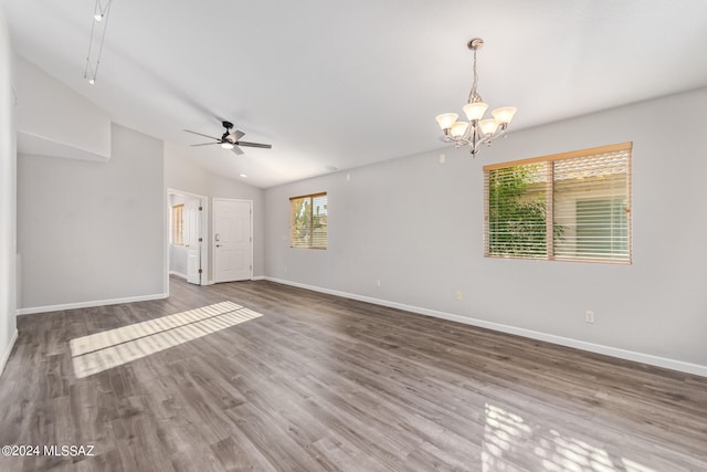 unfurnished living room with lofted ceiling, dark hardwood / wood-style flooring, and a healthy amount of sunlight