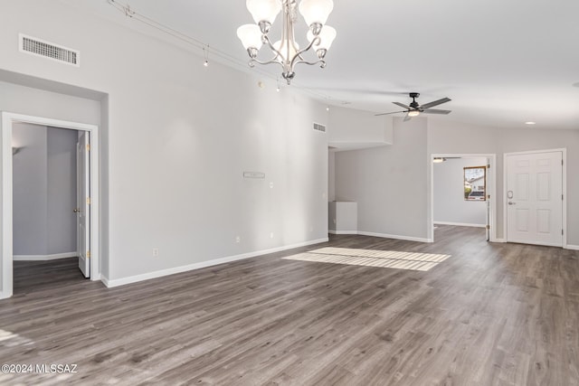 unfurnished living room featuring lofted ceiling, ceiling fan with notable chandelier, and dark hardwood / wood-style floors