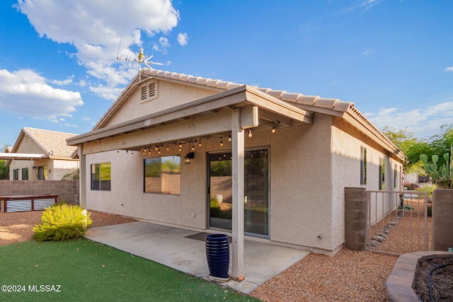 back of property featuring a patio area