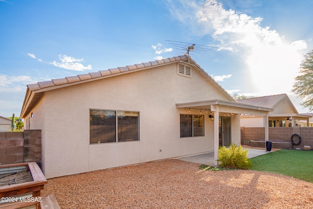 rear view of property with a patio area