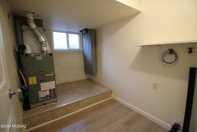 utility room with heating unit