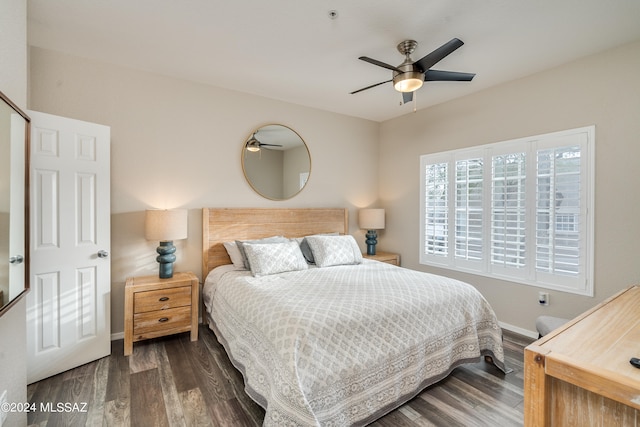 bedroom featuring ceiling fan and dark hardwood / wood-style floors