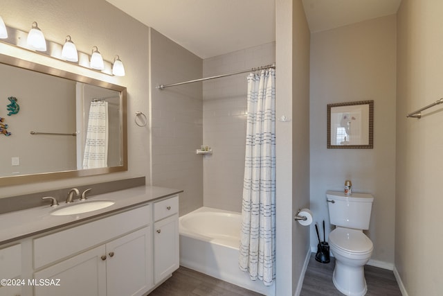 full bathroom featuring vanity, hardwood / wood-style floors, toilet, and shower / bathtub combination with curtain